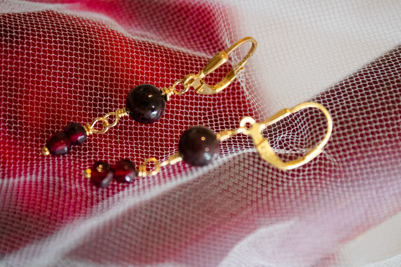 Strength. Earrings with garnets